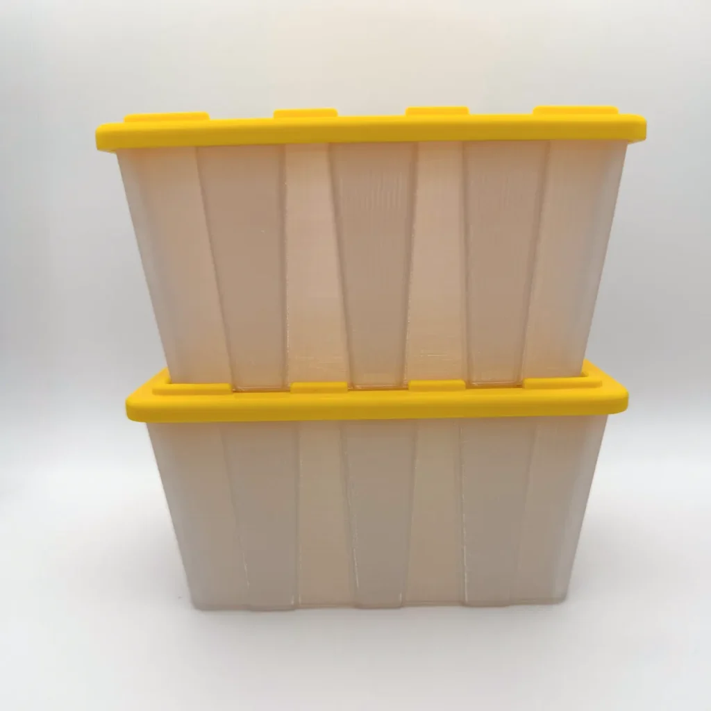 Two translucent mini storage tote bins with yellow snap-on lids, stacked one on the other