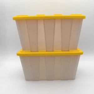 Two translucent mini storage tote bins with yellow snap-on lids, stacked one on the other